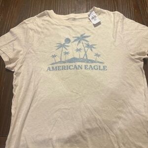 American Eagle Outfitters Beige Tee with Blue Design